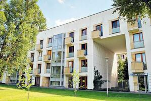 Modern and new apartment building. Multistoried, modern, new and stylish living block of flats. photo