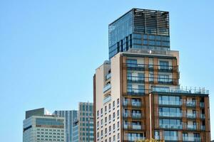 Modern and new apartment building. Multistoried, modern, new and stylish living block of flats. photo