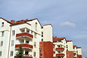 Modern and new apartment building. Multistoried, modern, new and stylish living block of flats. photo