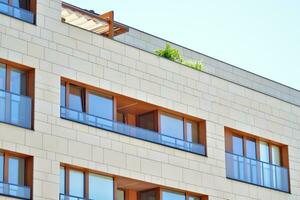 Modern and new apartment building. Multistoried, modern, new and stylish living block of flats. photo