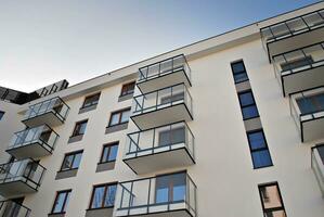 Modern and new apartment building. Multistoried, modern, new and stylish living block of flats. photo