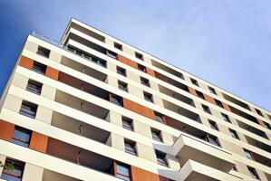 Modern and new apartment building. Multistoried, modern, new and stylish living block of flats. photo