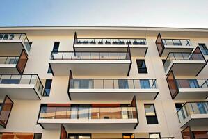 Modern and new apartment building. Multistoried, modern, new and stylish living block of flats. photo