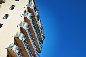 Modern and new apartment building. Multistoried, modern, new and stylish living block of flats. photo