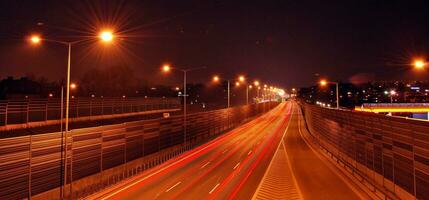 Light streaks and traces of movement in the city photo