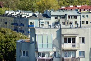 Modern luxury residential flat. Modern apartment building on a sunny day. White apartment building with a blue sky. Facade of a modern apartment building. photo