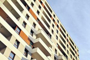 Modern and new apartment building. Multistoried, modern, new and stylish living block of flats. photo