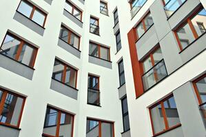 Modern and new apartment building. Multistoried, modern, new and stylish living block of flats. photo