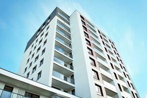 Modern and new apartment building. Multistoried, modern, new and stylish living block of flats. photo