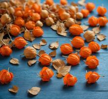AI generated Physalis on a blue wooden background. Copy space, selective focus. photo