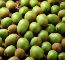 AI generated Kiwi fruits on wooden background. Top view. Flat lay. photo