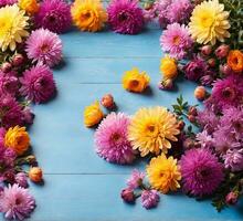 AI generated Colorful autumn flowers on blue wooden background. Flat lay, top view photo