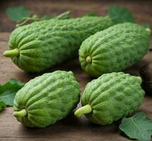 AI generated Fresh green cucumbers on wooden background. Healthy food. Vegetarian. photo