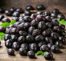 AI generated Ripe sweet dates with green leaves on a rustic wooden table. photo