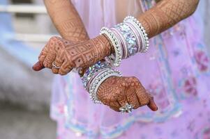 ndian bride's bangles close up photo