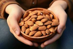 AI generated Childs delight close up of a hand holding a bowl, almonds within photo