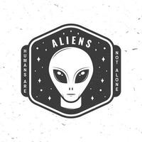 Aliens. Humans are not alone. Vector illustration Concept for shirt, print, stamp, overlay or template. Vintage typography design with alien and the space silhouette.