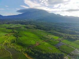 the beauty of the morning panorama with sunrise in indonesia village photo