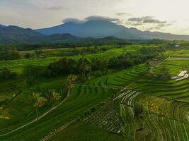 the beauty of the morning panorama with sunrise in indonesia village photo