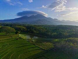 the beauty of the morning panorama with sunrise in indonesia village photo