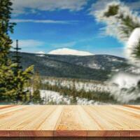 Wooden table top on nature background - can be used for montage or free display of your products photo