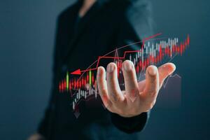 Business failure in the hands of businessmen. the graph downtrend, bear stock market, economic crisis, or recession. photo