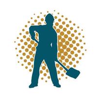 Silhouette of a worker carrying shovel tool. Silhouette of a worker in action pose using shovel tool. vector