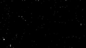 Falling snow flakes, Flying dust particles on a black background. Abstract winter background. Winter landscape with falling shining beautiful snow. photo