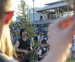 Moscow, Russia - 07.09.2023 - Visitors enjoying street band performance next to VDNKH metro station. Music photo