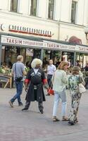 Moscow, Russia - 07.24.2023 - People enjoying day out at famous Arbat street. City photo