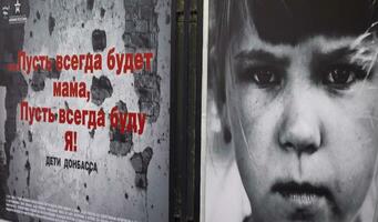 Moscow, Russia - 07.24.2023 - Photographs of the kids from the war zone placed on the Arbat street . City photo
