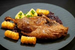 roasted duck with red  cabbage and potatoes photo