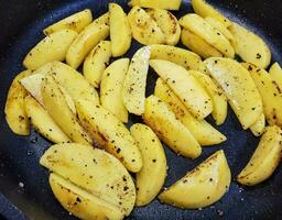 roasted potatoes with bacon onions and spices photo