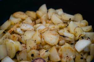 roasted potatoes with bacon onions and spices photo