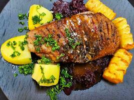 roasted duck with red  cabbage and potatoes photo