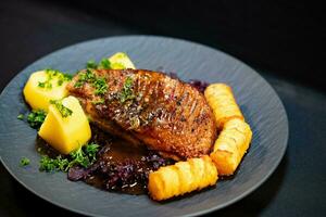 roasted duck with red  cabbage and potatoes photo