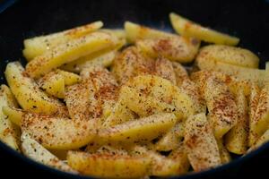 roasted potatoes with bacon onions and spices photo