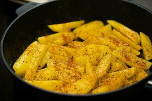 roasted potatoes with bacon onions and spices photo