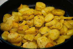 roasted potatoes with bacon onions and spices photo