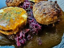 Fried meatballs with cabbage and parsley potatoes photo