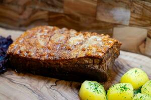 Pork Royal a traditional roast pork with red cabbage and potatoes photo