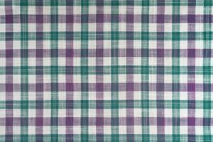 Purple and turquoise checkered texture fabric, tartan pattern background. photo