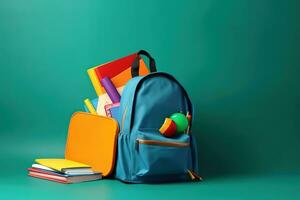 AI generated school backpack with books and pencils on green background photo