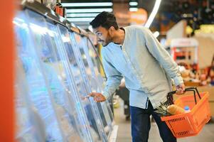 Man at grocery store products photo