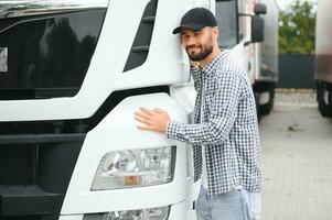 Man trucker hugging his truck photo