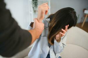 Angry husband beats his wife, domestic violence photo