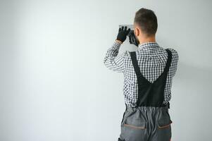 worker making repair in room. photo