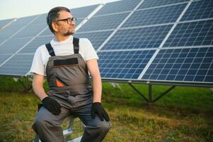 Portrait of a handyman who just installed solar panels. photo