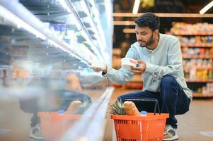 Man at grocery store products photo