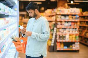 Man at grocery store products photo